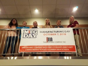 Students with Manufacturing Day sign